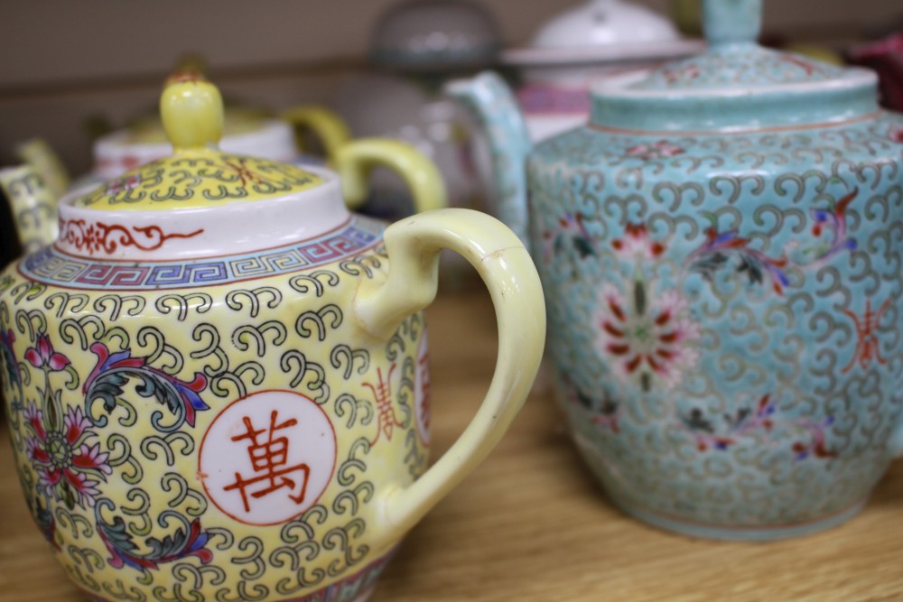 Three Chinese blue and white prunus pattern ginger jars, two other jars and ten assorted teapots